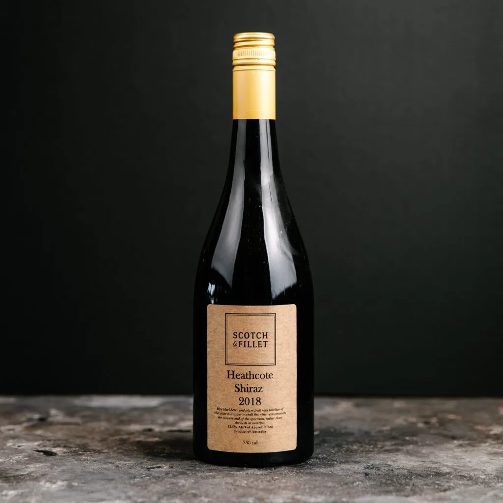 Heathcote Shiraz 2018 wine bottle with gold cap.